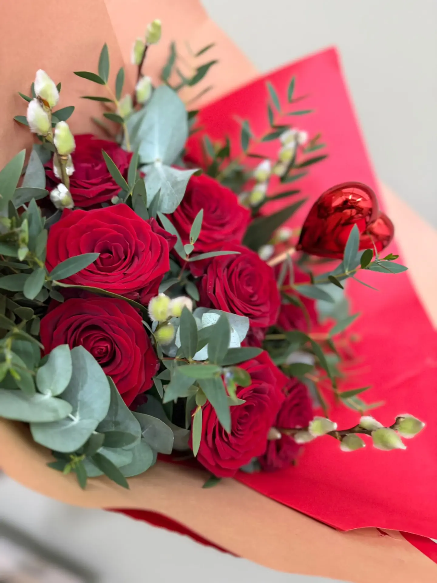 Red rose bouquet with eucalyptus and a red heart pick