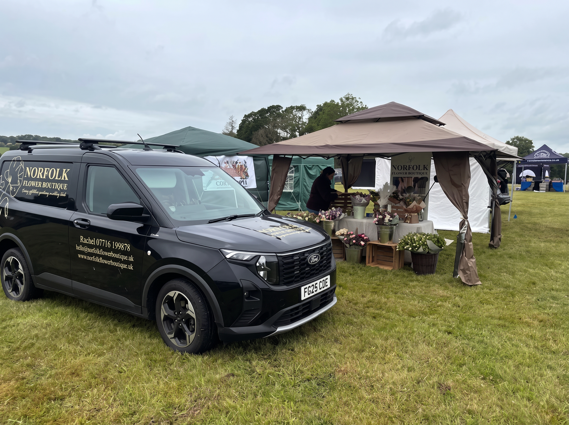 The Norfolk Flower Boutique black van beside the flower stall at a Norfolk country show