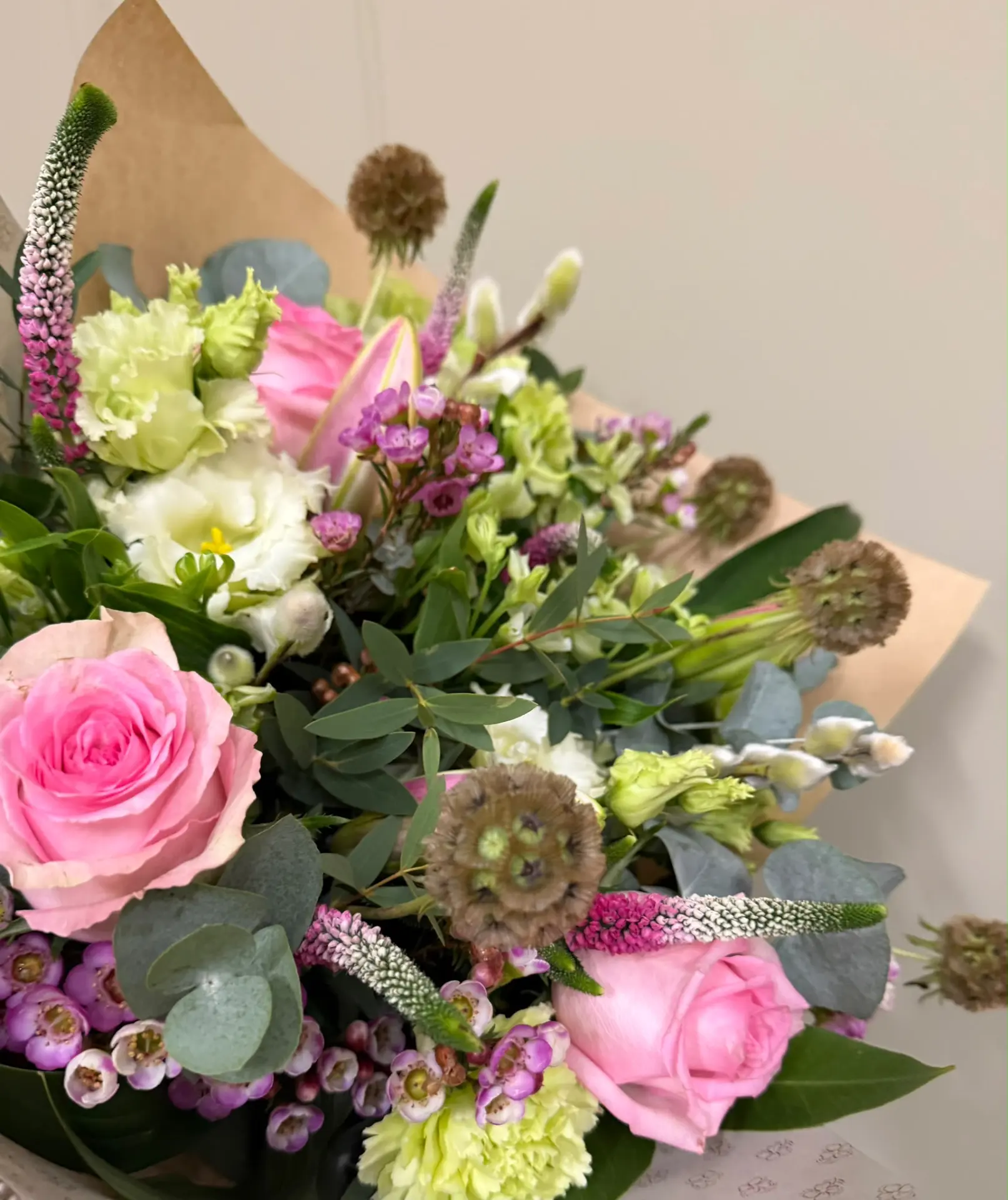 Soft pink rose and veronica hand-tied sympathy bouquet